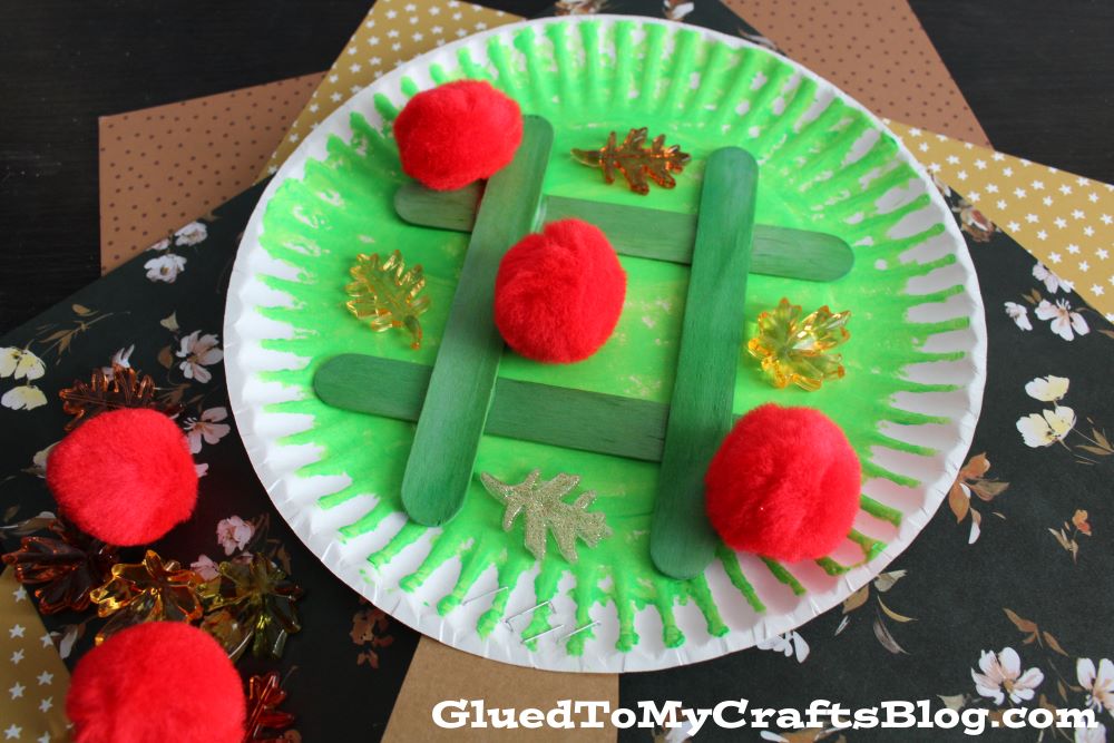 Crafting the Paper Plate Apple Tree Tic Tac Toe Game is a wonderful way to engage kids in a creative and educational activity. 