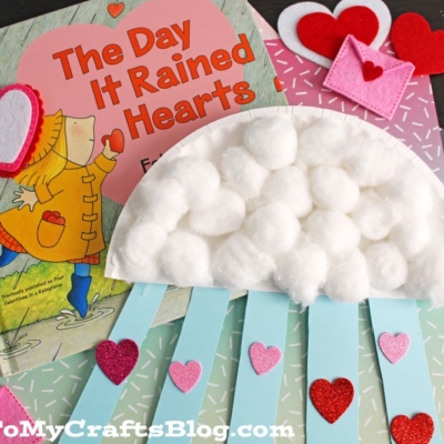 A book on a table sits beside a paper plate, perfect for crafting on a rainy day inspired by It Rained Hearts.