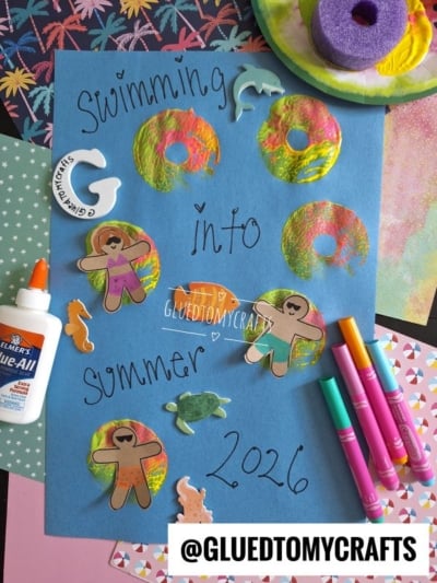 A blue poster reads Swimming into Summer 2026 with Pool Noodle Stamped Inflatable Raft art, painted swim rings, felt and paper cutouts of people and sea animals, glue, markers, and a sponge on a colorful craft table. @GLUEDTOMYCRAFTS is at the bottom.