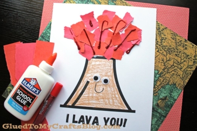 A torn paper volcano craft made with red paper pieces and glue on a printable sheet that says I LAVA YOU! The volcano has googly eyes and a smile.