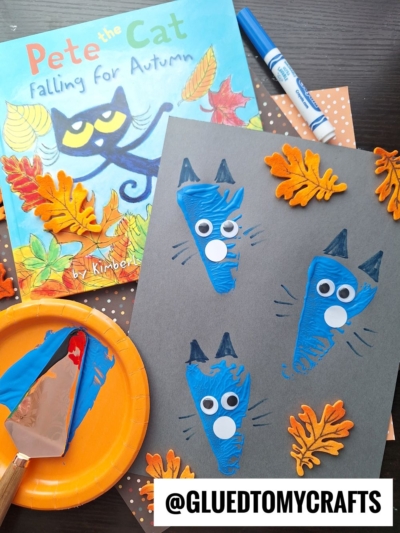 A group of children's art projects, including a pie server stamped with colorful designs, showcases their creativity.