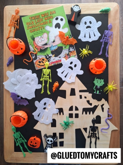 A board with Halloween decorations, perfect for inspiring fall themed sensory bin ideas.