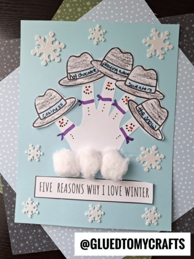 A winter-themed kids craft features a handprint with cotton ball mittens, hats listing winter favorites, snowflake stickers, and a label saying FIVE REASONS WHY I LOVE WINTER. This delightful project is inspired by a classic handprint snowman craft, encouraging kids to celebrate the season while creating their own frosty masterpiece.