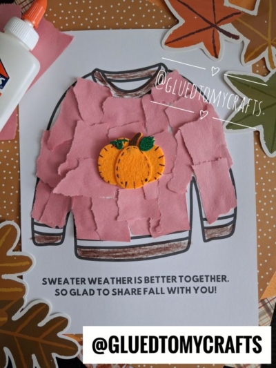 A fall-themed craft displays a torn paper fall sweater outline, covered with pink paper pieces and topped with an orange felt pumpkin. Text reads: SWEATER WEATHER IS BETTER TOGETHER. SO GLAD TO SHARE FALL WITH YOU!.