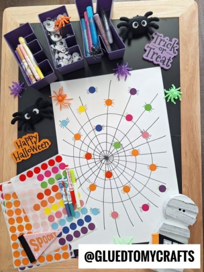 DRAW A LARGE WEB DESIGN ON PAPER AND ADD CODING DOT SPIDERS