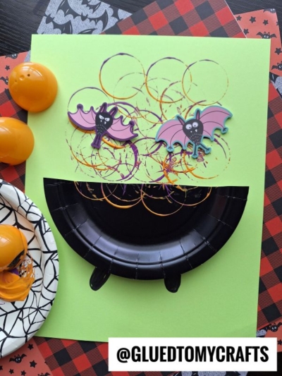USE PLASTIC EGGS TO STAMP A BUBBLE CAULDRON ON PAPER