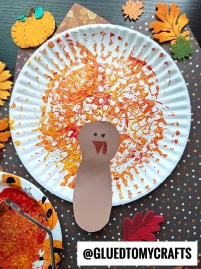 Paper Plate & Potato Masher Stamped Turkey Craft Idea For Thanksgiving