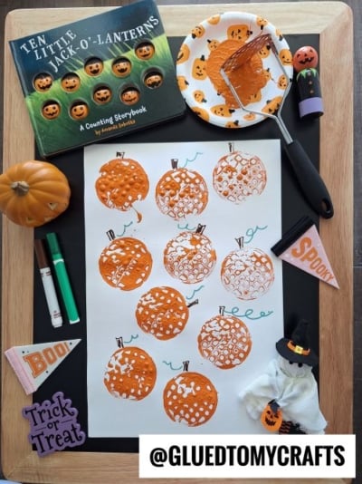 Potato Masher Stamped Pumpkins For Story Time
