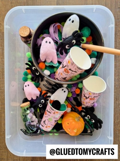 A bucket of Halloween decorations, perfect for inspiring fall themed sensory bin ideas.
