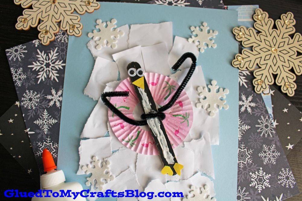 Torn Paper & Popsicle Stick Snow Tubing Penguin Craft Idea