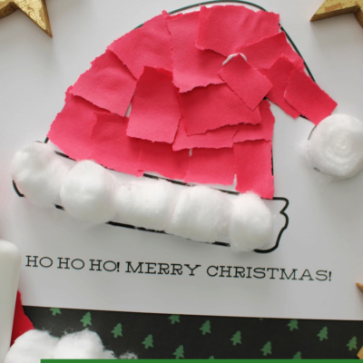 A Christmas craft featuring a torn paper Santa hat made from red paper and cotton balls on a printable with HO HO HO! MERRY CHRISTMAS! text, plus decorative golden stars and bold FREE PRINTABLE!!! text.