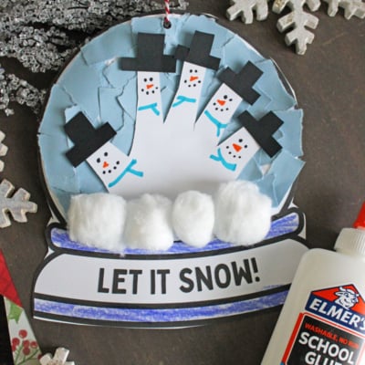 Torn Paper Snow Globe Craft For Kids To Make This Winter - gluedtomycrafts