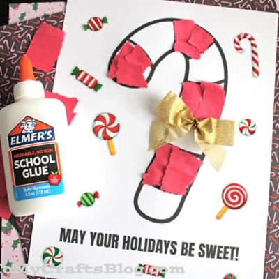 A holiday craft featuring a torn paper candy cane outline decorated with red paper pieces and a gold bow, surrounded by candy illustrations. Text reads May Your Holidays Be Sweet!