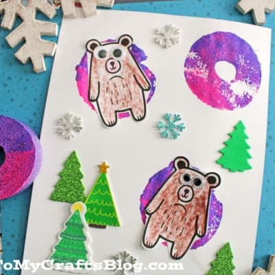 A winter-themed craft displays two paper bears appearing to snow tube on pool noodle stamped snow tube shapes, surrounded by paper trees and snowflake stickers on a white background.
