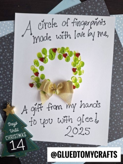 A handmade card with a fingerprint wreath, red dots, and a gold bow—perfect for CHRISTMAS CRAFTS FOR KIDS. The text reads: “A circle of fingerprints made with love by me, a gift from my hands to you with glee! 2025.” Countdown: 14 days until Christmas.