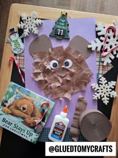 A bear craft made of brown paper, googly eyes, and a purple background is surrounded by snowflake ornaments and other festive touches—perfect CHRISTMAS CRAFTS FOR KIDS alongside a snowman card, candy canes, and "Bear Stays Up for Christmas.