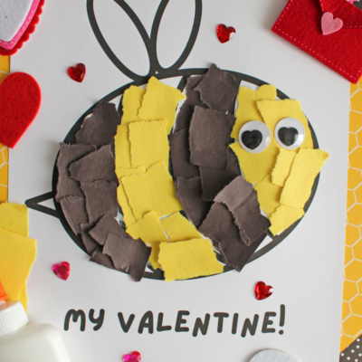 A Valentine’s Day torn paper bee craft made with yellow and brown scraps, googly eyes, and “MY VALENTINE!” below. Surrounded by heart decorations, a bottle of school glue, and “FREE PRINTABLE!” at the bottom.