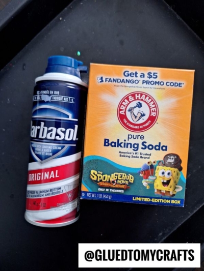 A can of Barbasol shaving cream stands next to a SpongeBob-themed box of Arm & Hammer pure baking soda. A @GLUEDTOMYCRAFTS label is at the bottom right of the image.