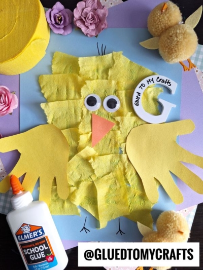 A yellow bird made out of paper.