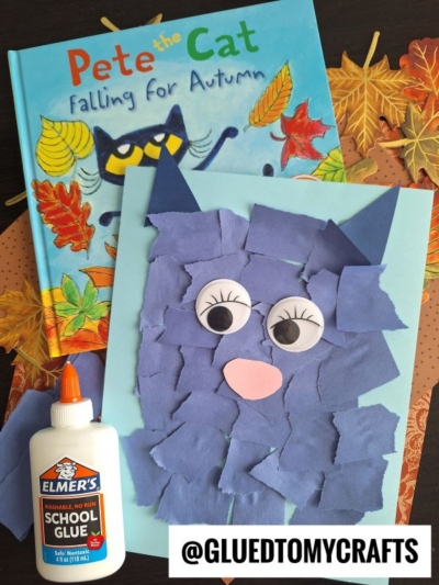 A children’s book titled “Pete the Cat: Falling for Autumn,” a torn-paper owl craft with googly eyes, Elmer’s glue, and autumn leaf-themed paper sit on a table—perfect for pete the cat crafts fans. @GLUEDTOMYCRAFTS is written at the bottom.