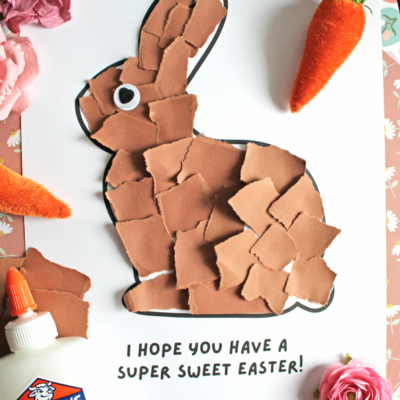 A torn paper collage of a brown chocolate bunny on white paper, surrounded by artificial carrots, a pink flower, and a glue bottle. Text reads I hope you have a super sweet Easter! and Free Printable!!!.