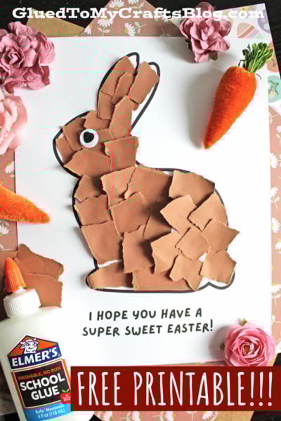 A torn brown paper bunny craft on white paper, decorated with fake carrots and a pink flower. There’s a bottle of Elmer’s glue and text that reads I HOPE YOU HAVE A SUPER SWEET EASTER! and FREE PRINTABLE!!!.