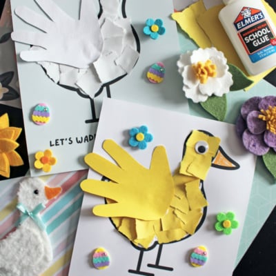 Two duck crafts made from handprints, paper pieces, googly eyes, and flower stickers are displayed alongside glue, felt flowers, and a small stuffed duck. The text reads LETS WADDLE INTO SPRING and FREE PRINTABLE!!!.