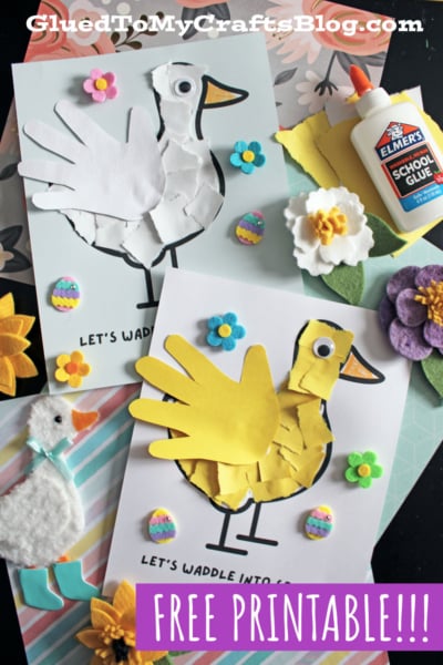 Two duck crafts made from handprints, paper pieces, googly eyes, and flower stickers are displayed alongside glue, felt flowers, and a small stuffed duck. The text reads LETS WADDLE INTO SPRING and FREE PRINTABLE!!!.