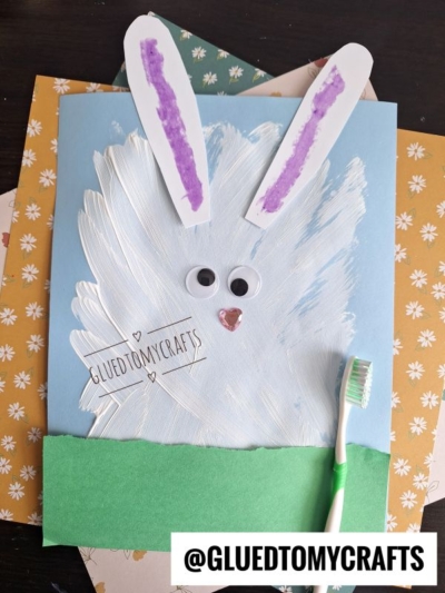 TOOTH BRUSH PAINTED BUNNY HIDING IN THE GRASS