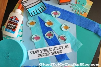 A selection of craft supplies, including Elmers glue, construction paper, paper fish cutouts, ink pads, an octopus shape, blue crepe paper, and a sign that says Summer is here—perfect for creativity on our Summer Printables - Landing Page!.