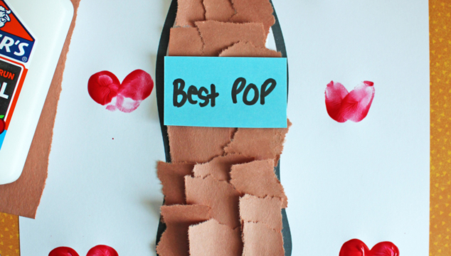 A craft project featuring a paper soda bottle decorated with brown paper squares, a blue label reading “Best Pop,” and red heart stamps. Text below says, Youre an amazing pop! Full of fizz and love! with “Free Printable!!!” banner.