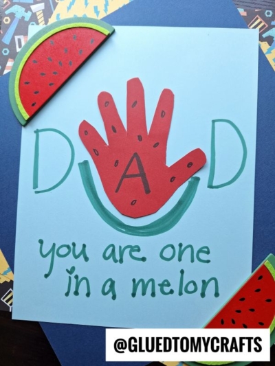 A handmade HANDPRINT FATHER'S DAY card features a red handprint shaped like a watermelon, forming the A in DAD. Below, green text reads you are one in a melon, with watermelon slices in the corners and @GLUEDTOMYCRAFTS at the bottom.