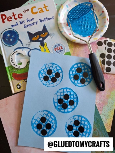 A Pete the Cat book, a potato masher stamped craft using blue paint and black dot stickers for button holes, plus a plate with paint. The Instagram handle @GLUEDTOMYCRAFTS is at the bottom.