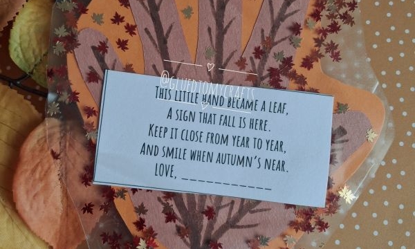 A handmade autumn craft shaped like a leaf with a poem on top, surrounded by orange paper, faux leaves, and berries. The Instagram handle @GLUEDTOMYCRAFTS is at the bottom.
