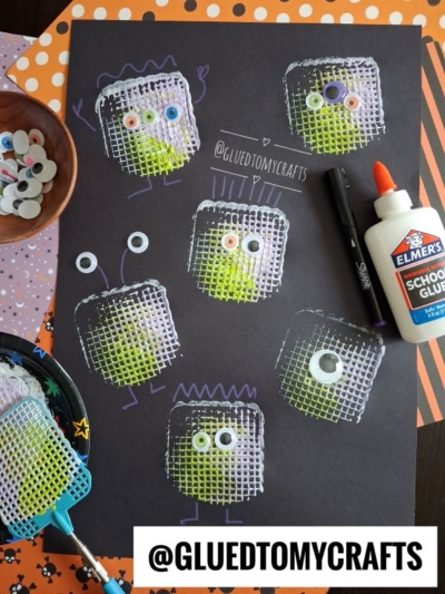 Monster crafts made from white mesh paint stamps, googly eyes, and drawn details on black paper—perfect Halloween Crafts for Kids! Includes glue, markers, googly eyes, and a painted fly swatter. @GLUETOMYCRAFTS is visible.