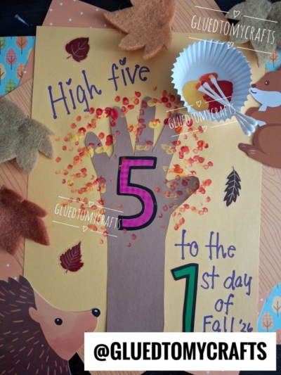A delightful children’s fall craft featuring a handprint tree, colorful leaves, the number 5, and cheerful text that says “High five to the 1st day of Fall.” This creative project is surrounded by charming animal and leaf cutouts, making it one of the perfect FALL CRAFTS FOR KIDS to celebrate the season.