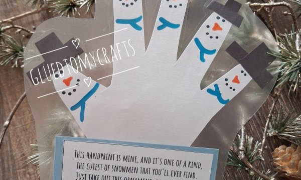 A laminated handprint ornament with fingers decorated as snowmen, featuring a poem about keeping a small piece of the childs year.